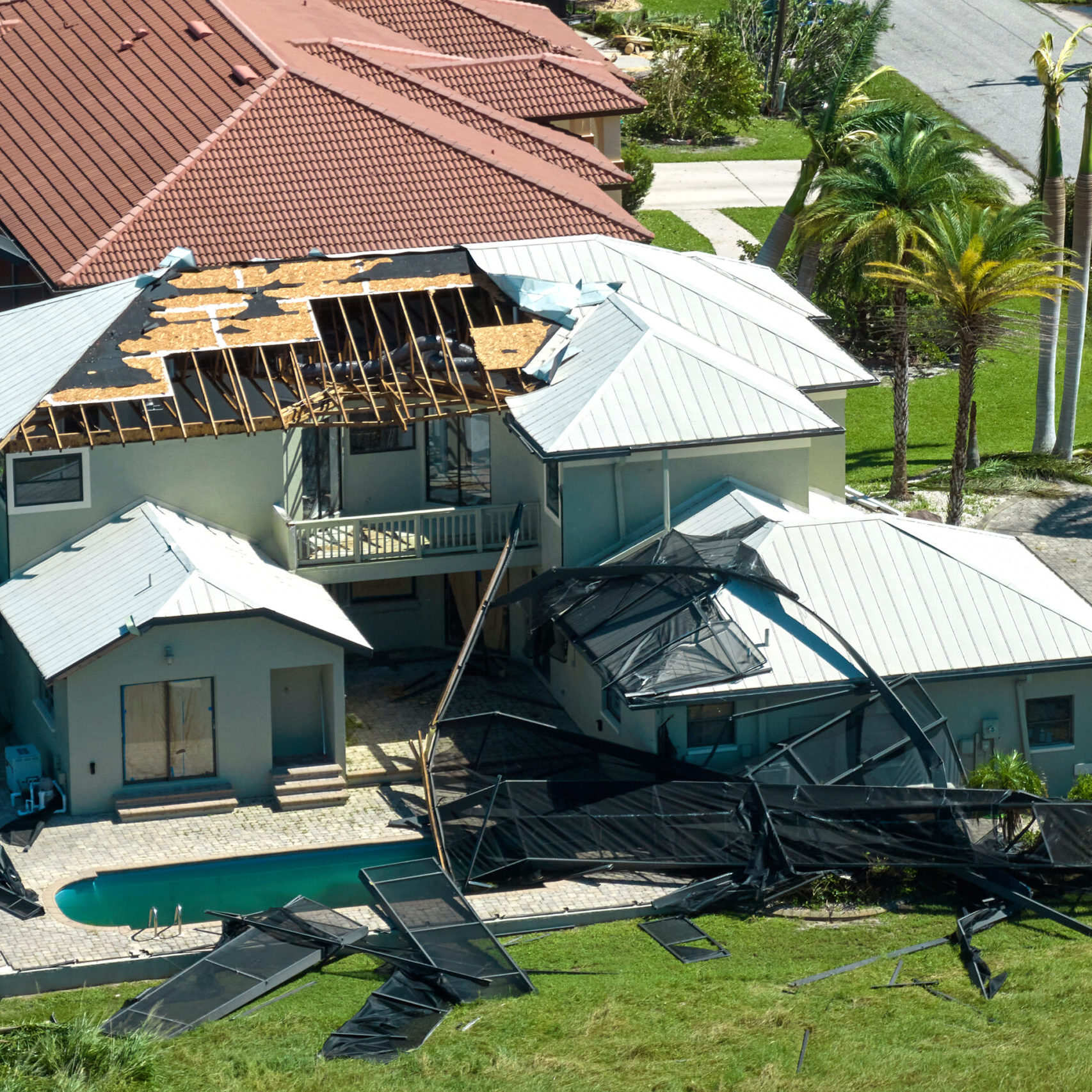 Hurricane Ian destroyed house in Florida residential area. Natural disaster and its consequences.
