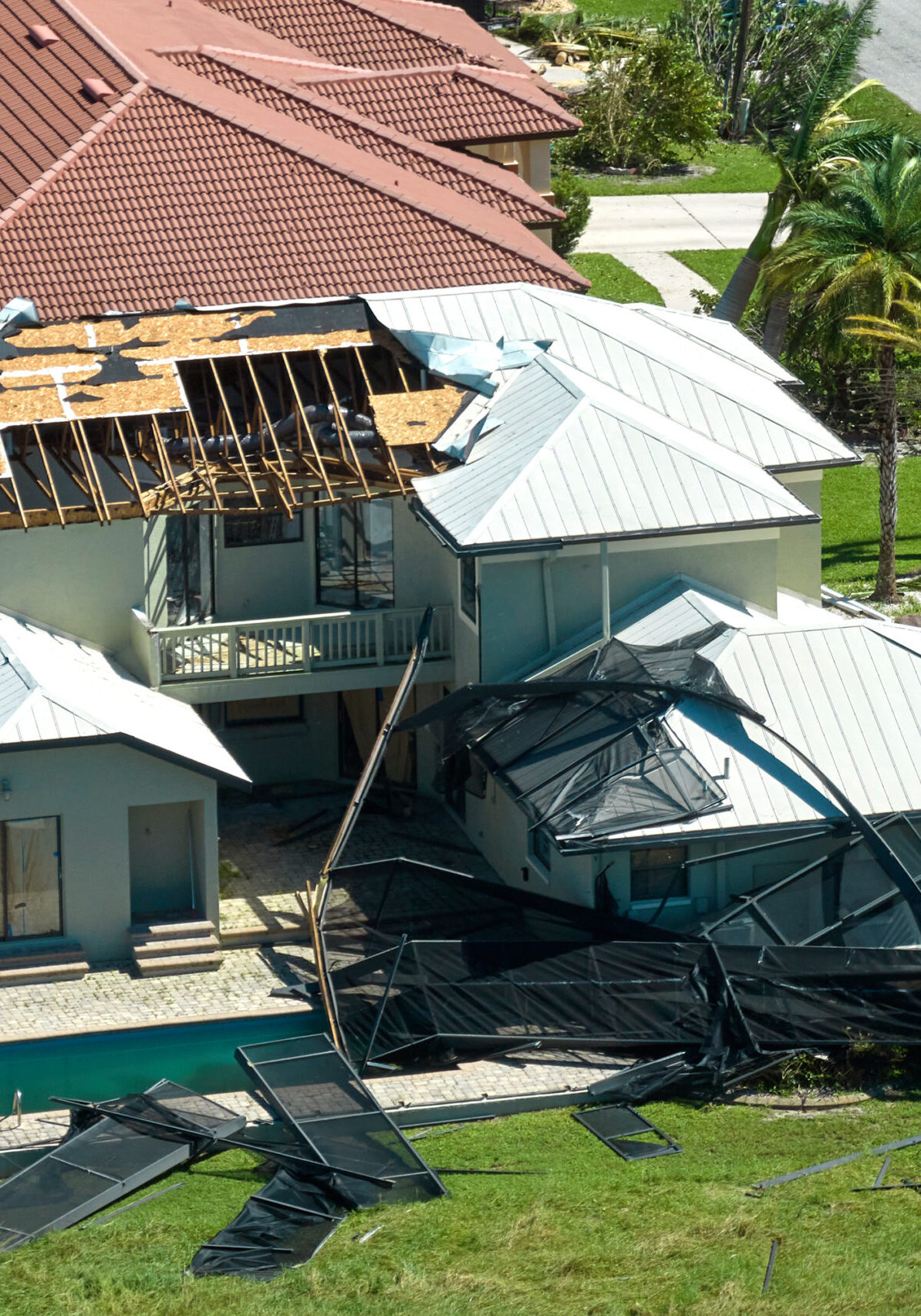 Hurricane Ian destroyed house in Florida residential area. Natural disaster and its consequences.